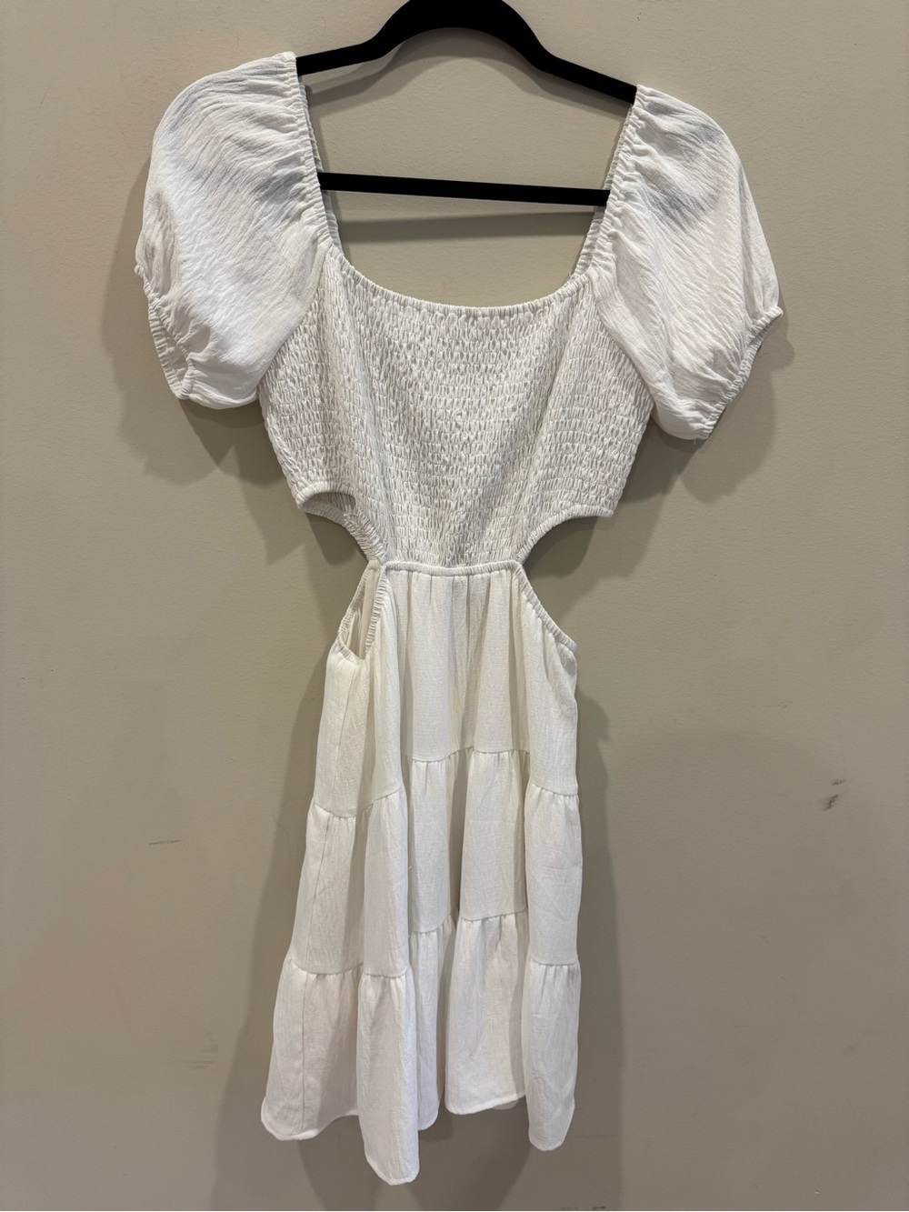 Altar'd State white smocked bodice mini dress with side cutouts and puff sleeves